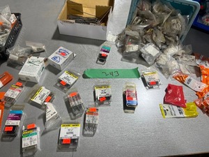 TABLE FULL OF ANODIZED BOLTS, HINGES, & SCREWS