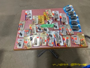 TABLE FULL OF ANTENNA DISCONNECTS, CLOCKS, & MIRROR MOUNTING BRACKETS