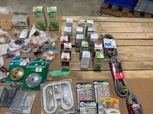 TABLE FULL OF OUTDOOR SWITCH & RECEPTICAL PLATES, 220 RANGE CORDS, OUTLET WALL ADAPTERS, & MISC BULBS