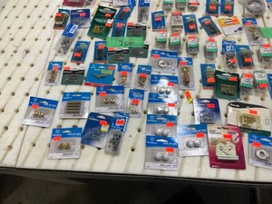 TABLE FULL OF WALL RECEPTICAL COVER SCREWS
