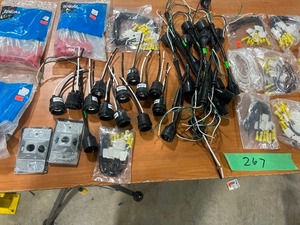 TABLE FULL OF ELECTRICAL PIGTAILS, & OUTDOOR COVERS