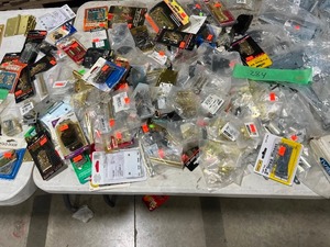 TABLE FULL OF DOOR HINGES, HINGE PINS, LOCKING HASPS, S HOOKS, & HANGERS