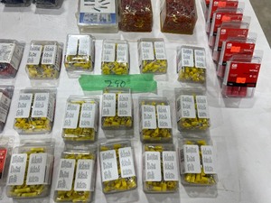 TABLE FULL OF WIRE CONNECTORS, RED, YELLOW, AND BLUE