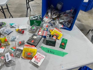 TABLE FULL OF SMALL SNAPS, RIVETS, & METAL CROSS DOWELS