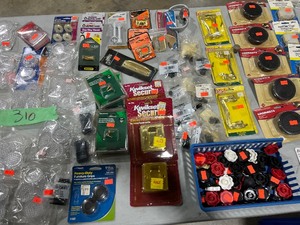 TABLE FULL OF FURNITURE LEG SAVERS, GROMMETS, & POCKET DOOR ACCESORIES
