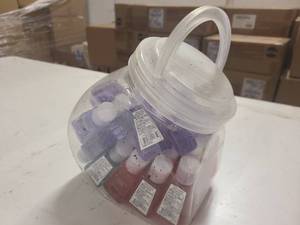Small cannister of sample size hand sanitizers