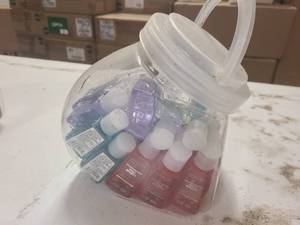 Small cannister of sample size hand sanitizers