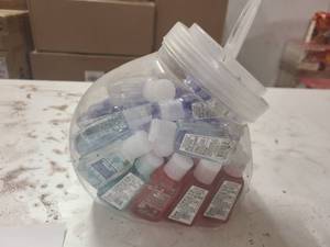 Small cannister of sample size hand sanitizers