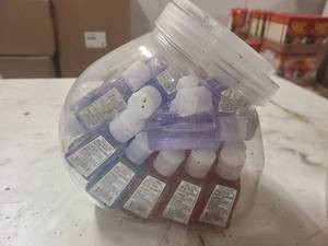 Small cannister of sample size hand sanitizers