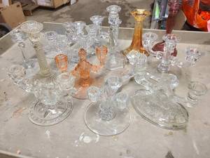Large assortment of vintage candles sticks, some crystal, some depression glass and more