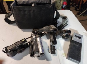 lot 12 image: Camera Kit Includes Bag, Canon Sure Shot Camera, Kodak Easy Share Camera, Samsung DuoCam Video Recorder and Small Handheld Audio Recorder