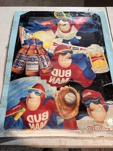 lot 324 image: Bud Man Poster Budweiser Poster with Tape Across front