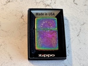 lot 221 image: Iridescent Zippo Lighter Engraved with Dream Catcher