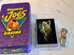 lot 227 image: Smoking Joe Camel Race Tin and Two Lighters