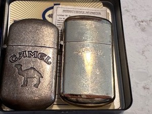lot 199 image: Two Vintage Camel Lighters in Camel Midnight Madness Uncork the Excitement Metal Tin