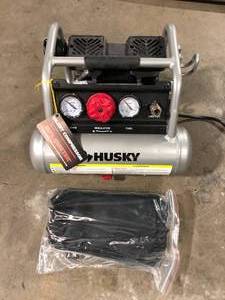 lot 50 image: Husky 1 Gal. Portable Electric-Powered Silent Air Compressor  Customer Returns See Pictures