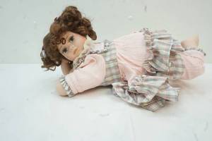 lot 92 image: Porcelain doll