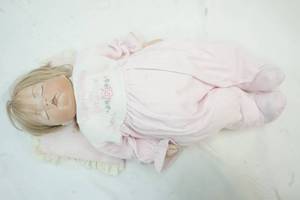 lot 93 image: Porcelain doll