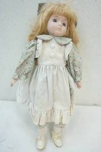 lot 94 image: Porcelain doll
