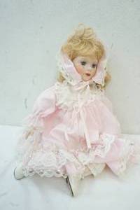 lot 95 image: Porcelain doll