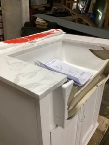 lot 64 image: OVE Decors Jesse 30 Utility Sink - Unused - Shipping Damaged Sink - Vanity Cabinet and marble top Ok