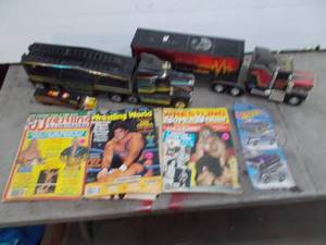 lot 58 image: vintage buddy metal trucks and wrestling magazines