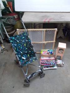 lot 59 image: baby gate, stroller, toys, books, baby dolls