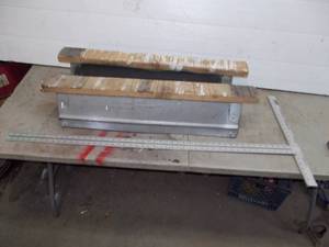 lot 72 image: 2 folding saw horses and a 48 drywall t-square