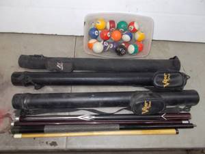 lot 79 image: pool cues, cases, and balls