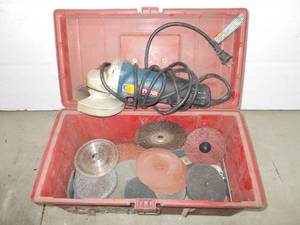 lot 84 image: ryobi 4.5 angle grinder with tool box and assorted cutting wheels