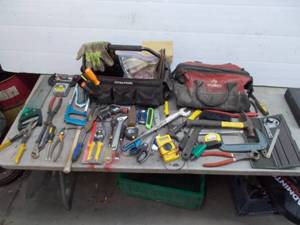 lot 89 image: tool bag and tool caddy full of assorted hand tools