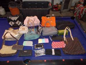 lot 127 image: Large assortment of purses, handbags, wallets and more.