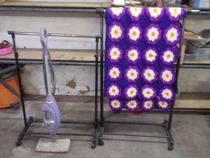 lot 136 image: 2 rolling clothing racks, Crochet Blanket, Shark Steam mop