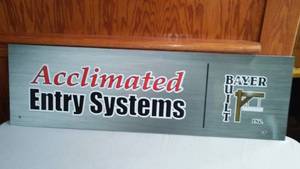 lot 508 image: Advertisement Sign. Acclimated Entry Systems (metal)