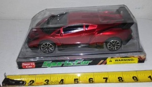 lot 7 image: Red Sports car toy.