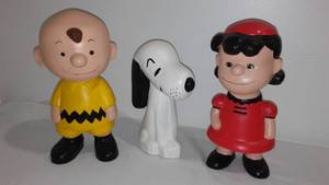 lot 245 image: Peanuts Charlie Brown, Lucy, and Snoopy Ceramic Figurines.