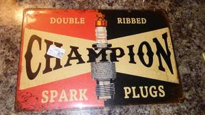 lot 295 image: Champion Spark plugs Metal Sign, 8 x 12.
