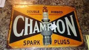 lot 337 image: Champion Spark Plugs Metal Sign, 8 x 12.