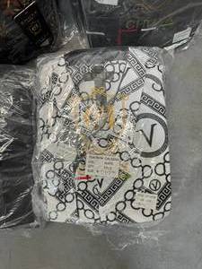lot 40 image: LOT of 19 Packages of Long Sleeve Button Up Shirts - Varying Sizes