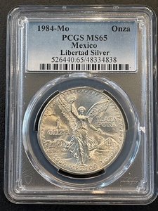 lot 18 image: 1984-MO Onza PCGS MS65 Mexico Libertad Silver