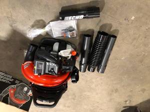 lot 10 image: ECHO 233 MPH 651 CFM 63.3cc Gas 2-Stroke Backpack Leaf Blower with Tube Throttle  Customer Returns See Pictures