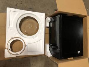 lot 11 image: Magic Chef 1.6 cu. ft. Countertop Microwave in Black with Gray Cavity  Customer Returns See Pictures