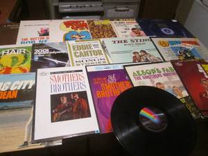 lot 84 image: (DLR) Assorted Records Including Smother Brothers, Olivia Newton John, Hair, Monty Python and More