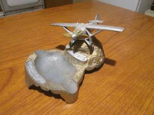 lot 116 image: (DLR) Vintage Ancient Art Metal Co. Metal Spirit of the Times Airplane Ashtray