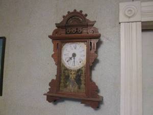 lot 170 image: (DLR) Vintage Wood Wall Clock Approx 25 x 14 12 - As-Is Hanging On The Wall - Needs Cleaning