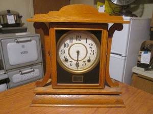 lot 171 image: (DLR) Vintage Wood Ingraham Eight Day Clock 13 12 H x 13 14 W - Needs Work, Missing hand and face is loose.