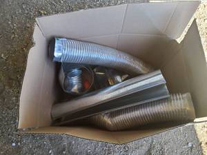 lot 67 image: Box of flex duct work, and New dryer vents