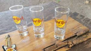 lot 152 image: Hard Rock Cafe....Las Vegas & Bottle Opener Atop a Black Wanlut Plank