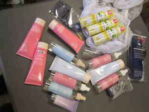 lot 41 image: Shopping tote loaded with Personal care lotions, body wash and other supplies