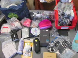 lot 46 image: Huge Assortment of ear bud covers, musc charging cables and other unique finds